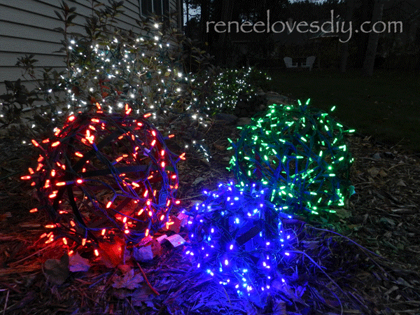 Balls wrapped in Christmas lights creates a beautiful outdoor Christmas scene!