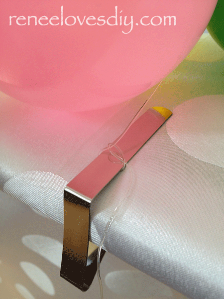 Balloon table runners need clips to hold them in place!